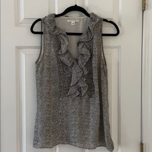 Sleeveless black and white animal print ruffle top